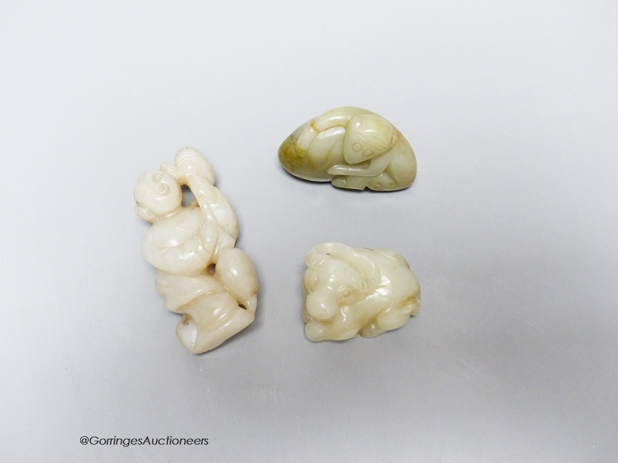 Three Chinese jade figures of a monkey, a buffalo and a lady, 4 - 7.2cm